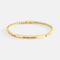 Gold bracelet with 'BECAUSE I SPARKLE' text on a white background