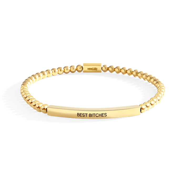 Gold bracelet with 'BEST BITCHES' engraving on a white background