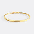 Gold bracelet with 'BEST BITCHES' engraving on a white background