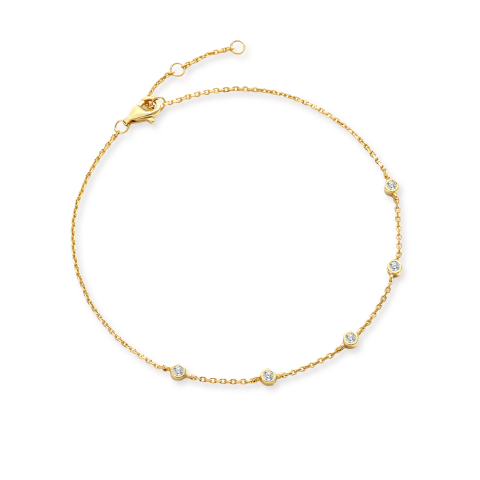 Gold bracelet with small diamonds on a white background