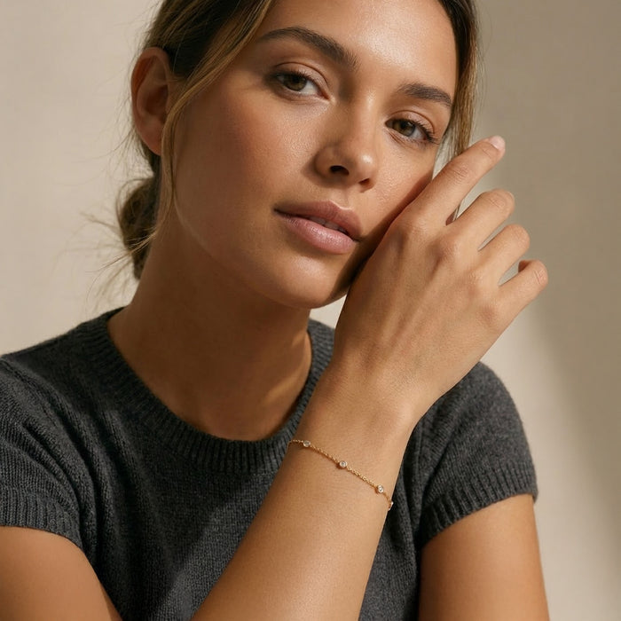 Woman wearing a dark gray sweater with a neutral background