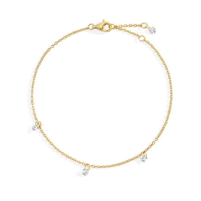 Gold bracelet with small diamonds on a white background