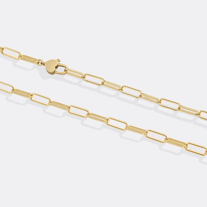 Gold chain necklace on a white background