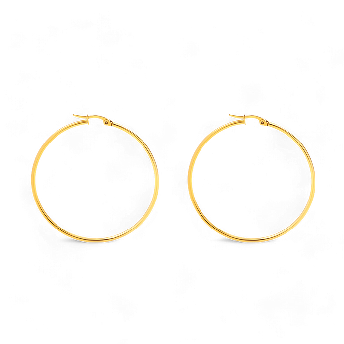 A pair of large, gold-colored hoop earrings on a black background.