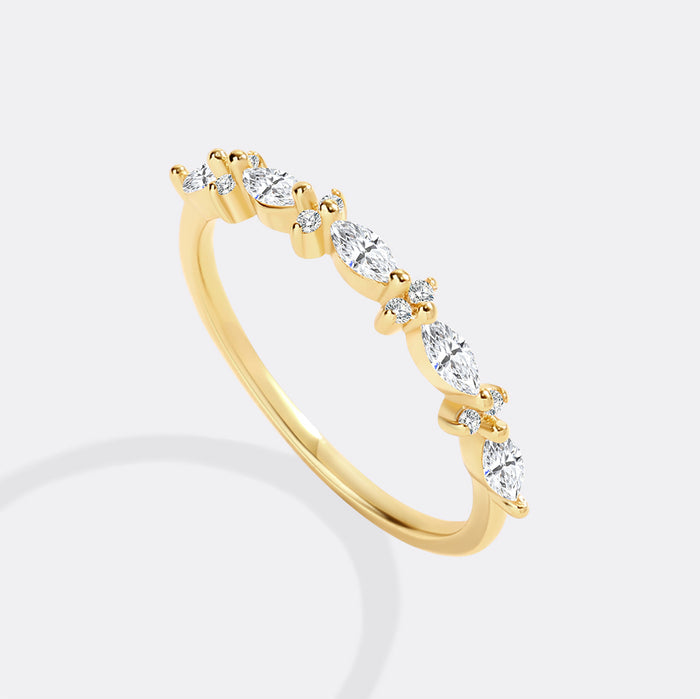 Gold ring with diamonds on a white background