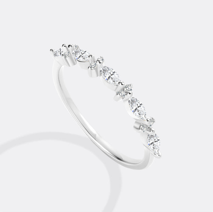 Silver ring with small diamonds on a white background
