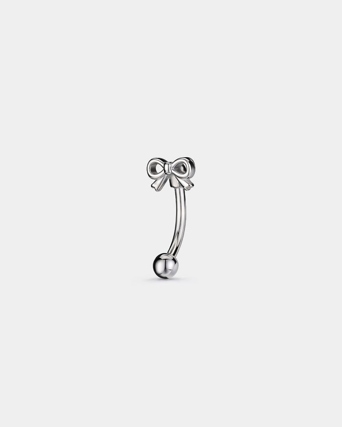 Bow eyebrow piercing