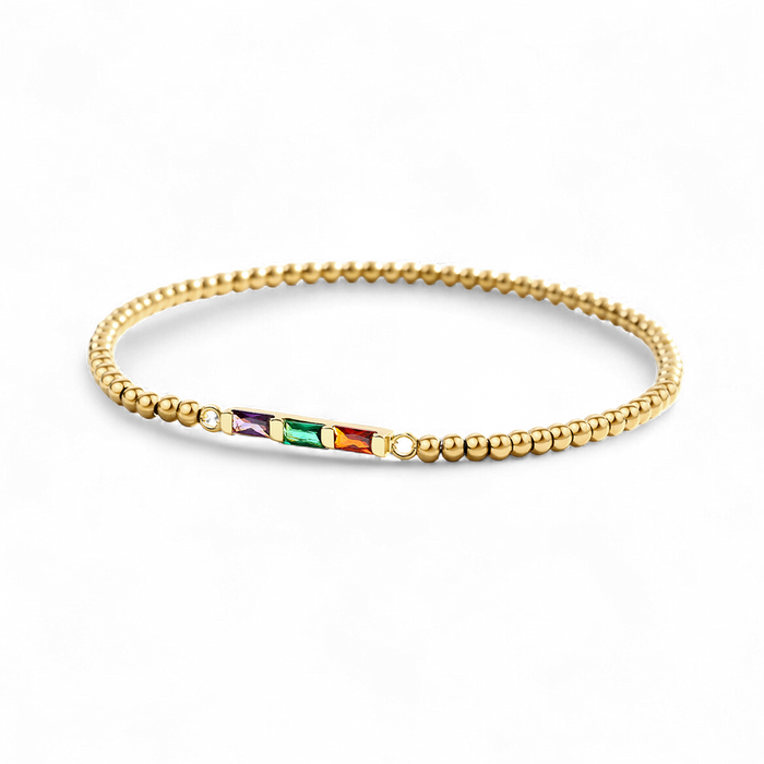 Gold beaded bracelet with colorful gemstones on a white background