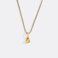 Gold necklace with a teardrop-shaped pendant on a white background
