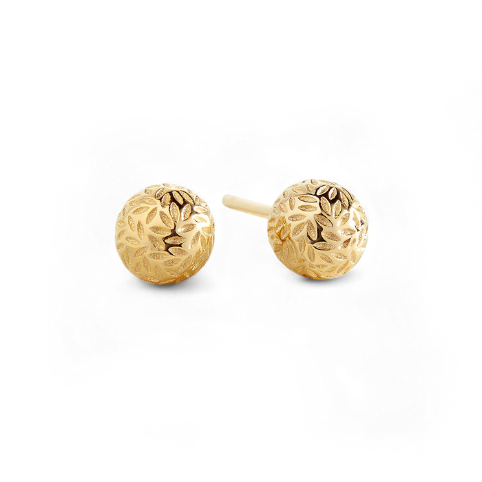 Pair of gold round earrings with intricate designs on a black background